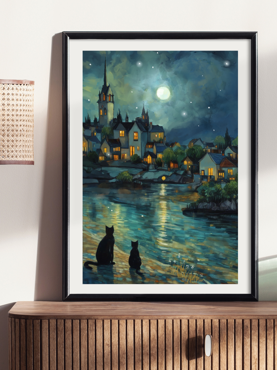 Framed artwork of a night scene with a town and two cats on a dock.