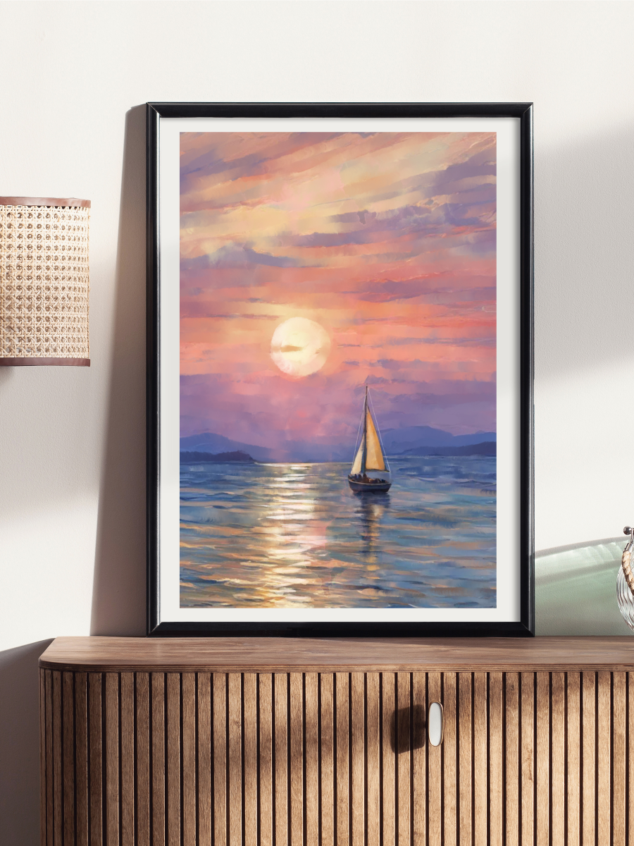 Framed artwork of a sailboat at sunset on a wall above a wooden cabinet.