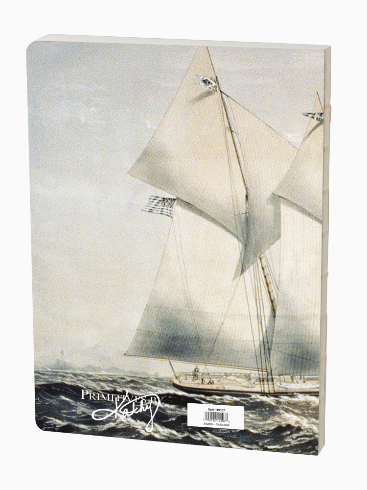 Notebook with a sailboat design on the cover.