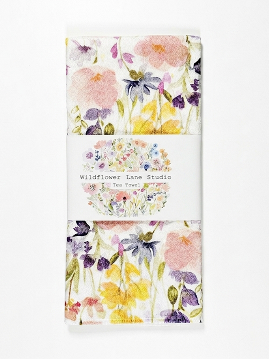 Tea towels with floral design and 'Wildflower Lane Studio' branding.