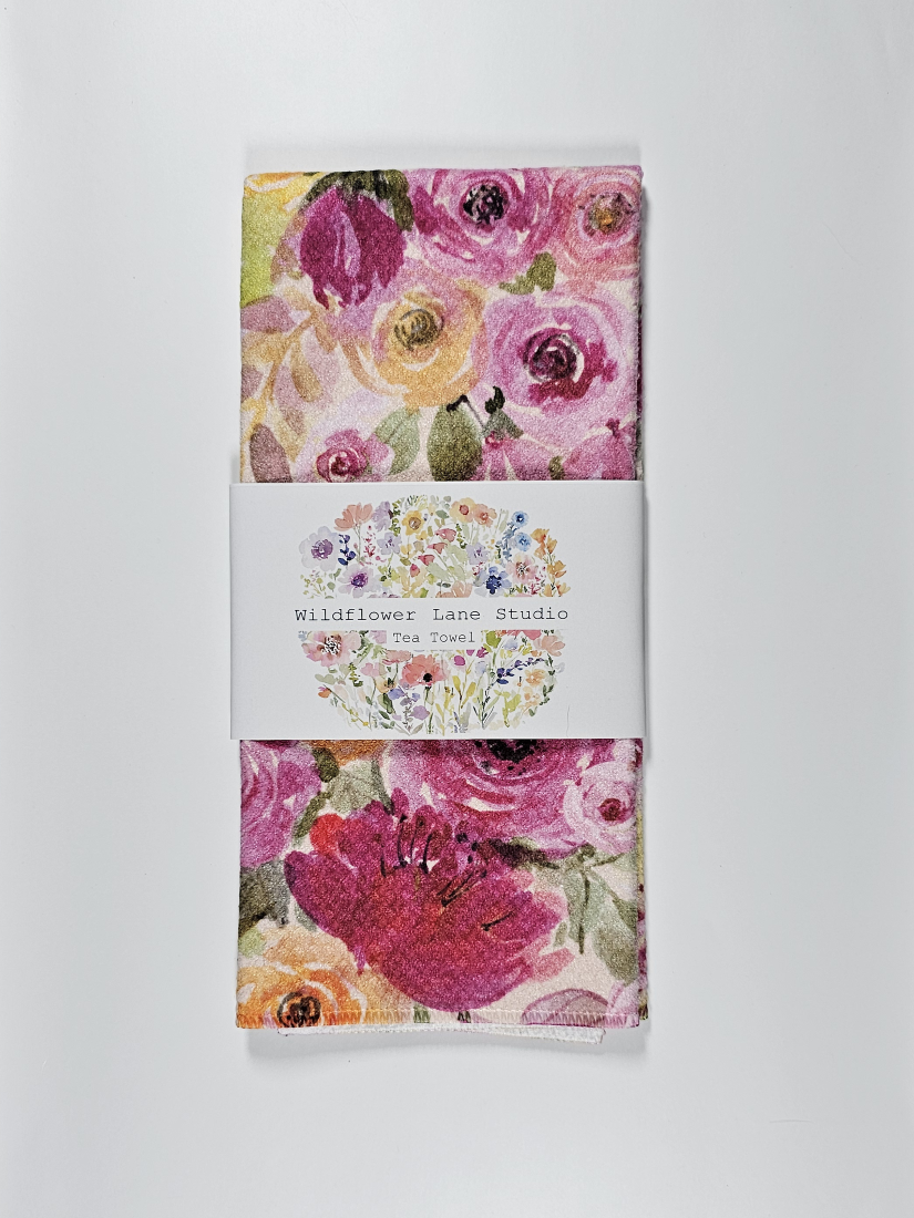 Floral tea towel with Wildflower Lane Studio branding on a white background