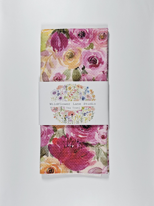 Floral tea towel with Wildflower Lane Studio branding on a white background