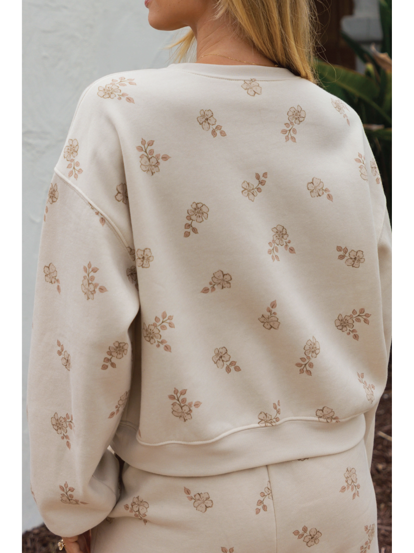 Cozy two-piece matching set in a soft-brushed fabric with a whimsical "Aloha" graphic and a relaxed, soulful coastal aesthetic.