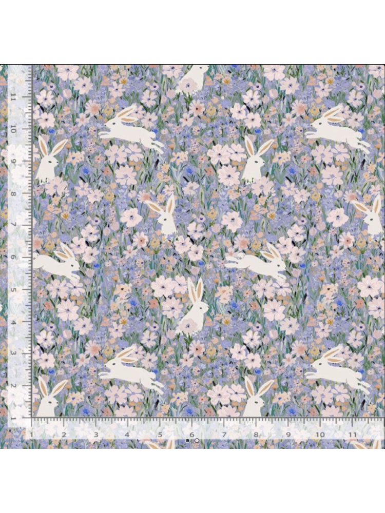 Whimsical fabric pattern with white rabbits leaping through a dense field of purple, pink, and blue watercolor wildflowers, rulers added for reference.