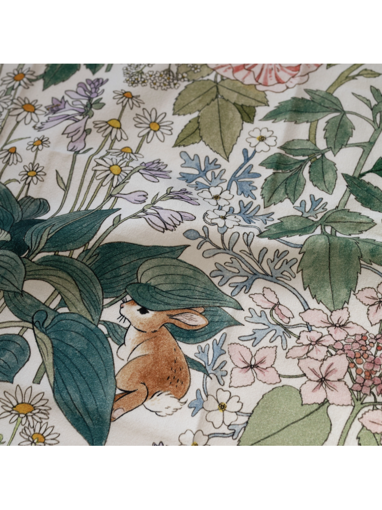 Floral pattern with a small animal among flowers and leaves