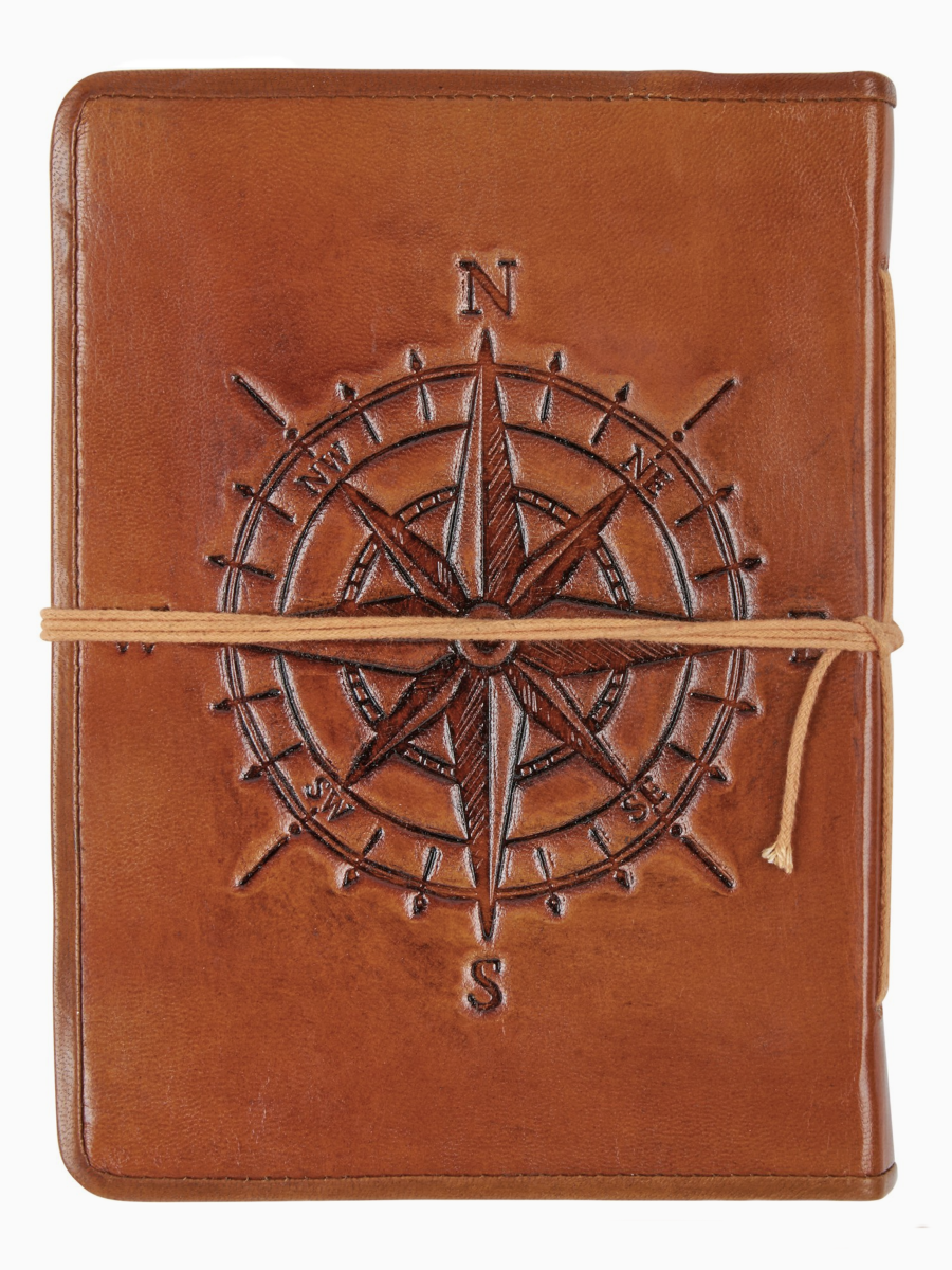 Brown leather notebook with compass design on a white background