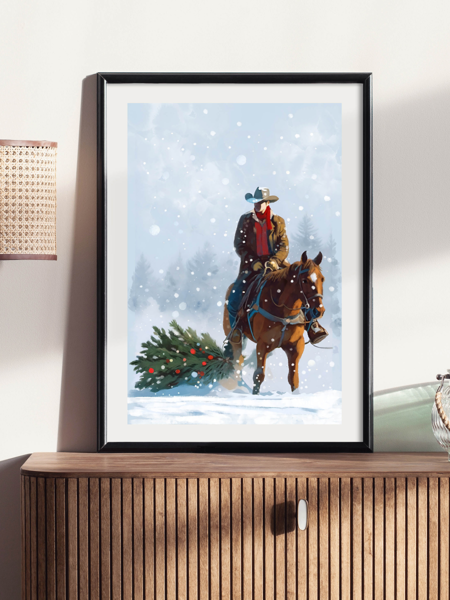 A painterly illustration of a cowboy on a brown horse dragging a decorated Christmas tree through a snowy forest during a light snowfall. Framed sample for reference.