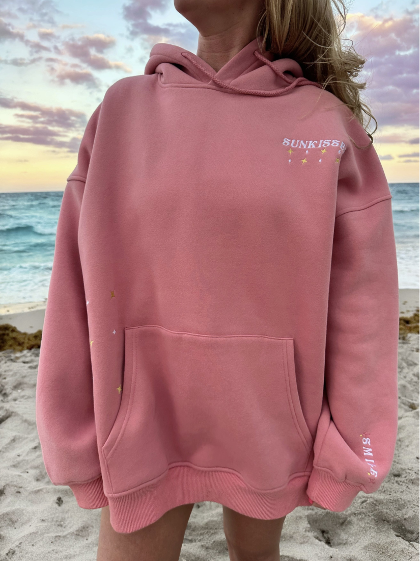 Cozy hoodie featuring a detailed embroidery of a travel van under a starry sky, perfect for a whimsical, adventure-focused slow-living style.