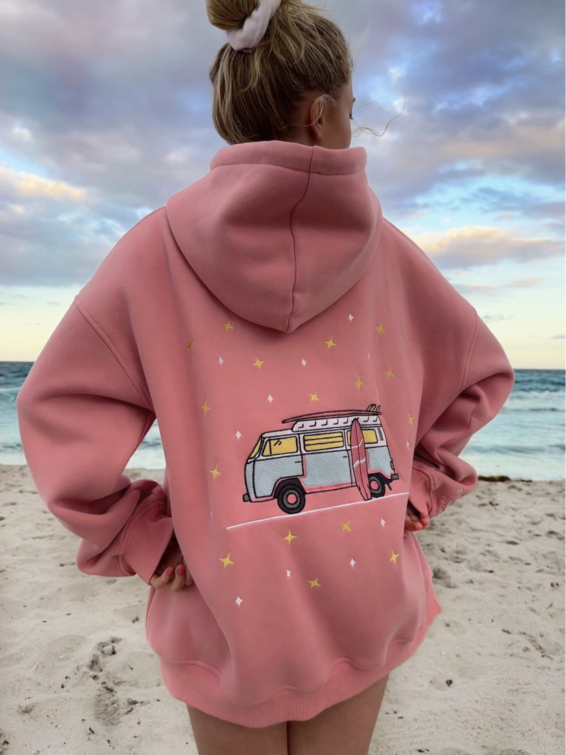 Cozy hoodie featuring a detailed embroidery of a travel van under a starry sky, perfect for a whimsical, adventure-focused slow-living style.