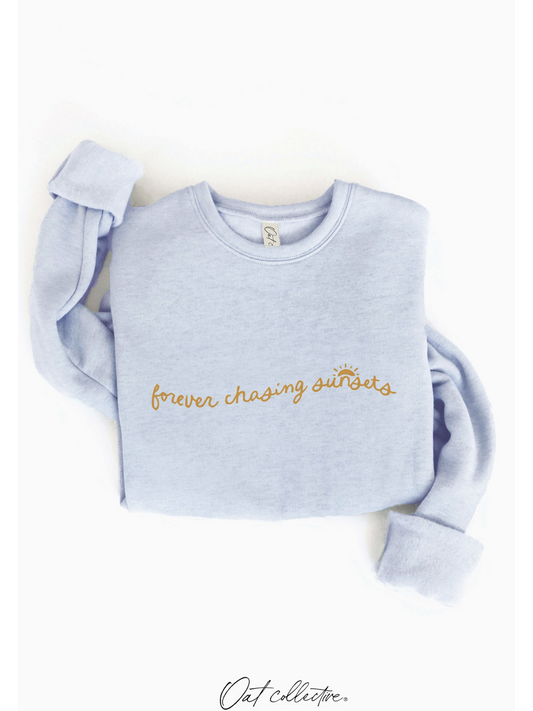 Forever Chasing Sunsets Graphic Sweatshirt (Light Blue color) - by OAT COLLECTIVE®
