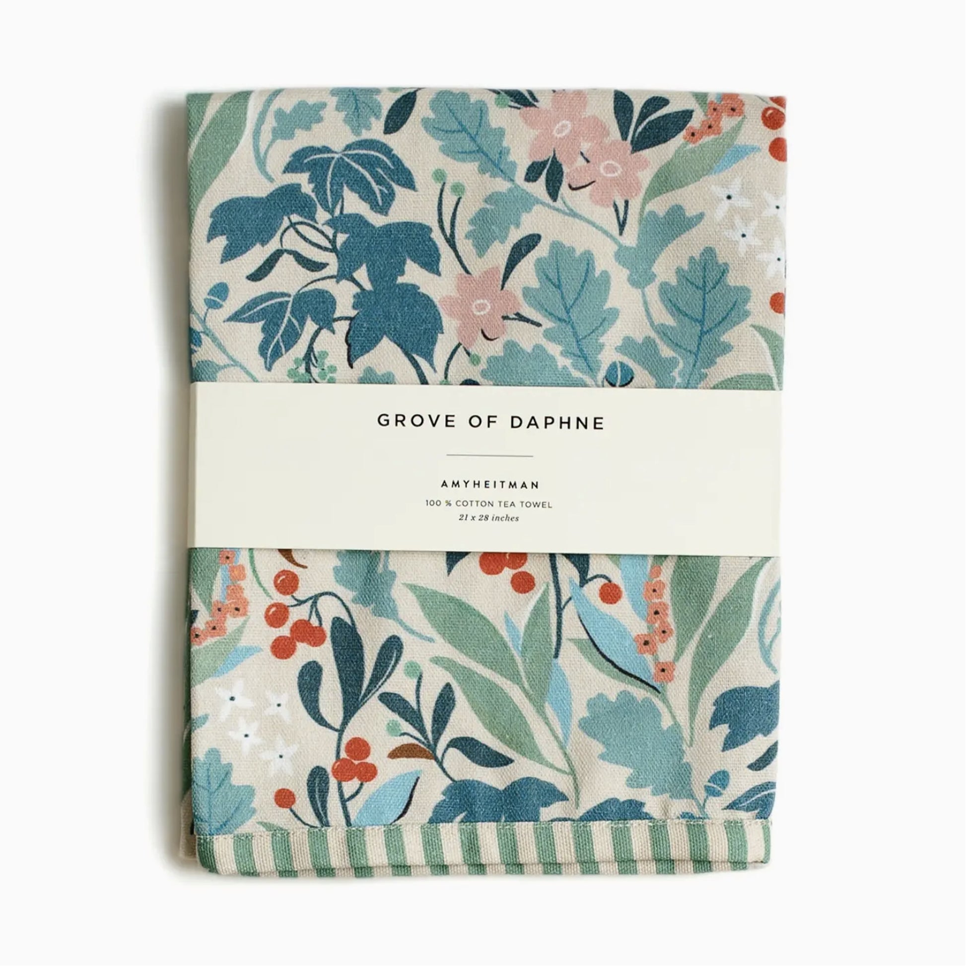 Whimsical watercolor tea towel featuring the 'Grove of Daphne' botanical print with lush green leaves and delicate flowers.