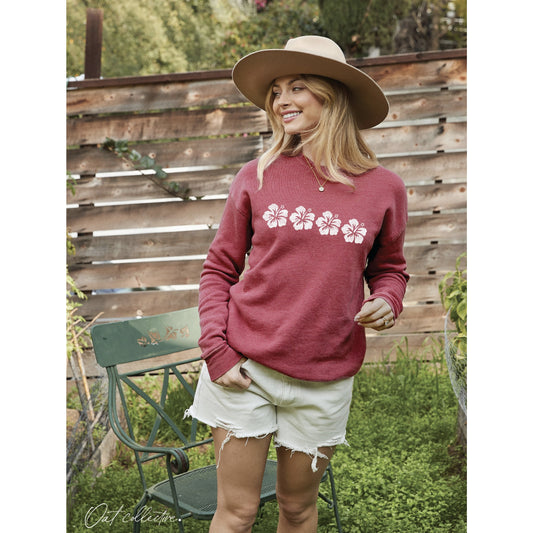 Mineral-wash sweatshirt with a whimsical hibiscus flower row graphic, featuring a soft-brushed texture and a soulful, vintage-inspired coastal look.
