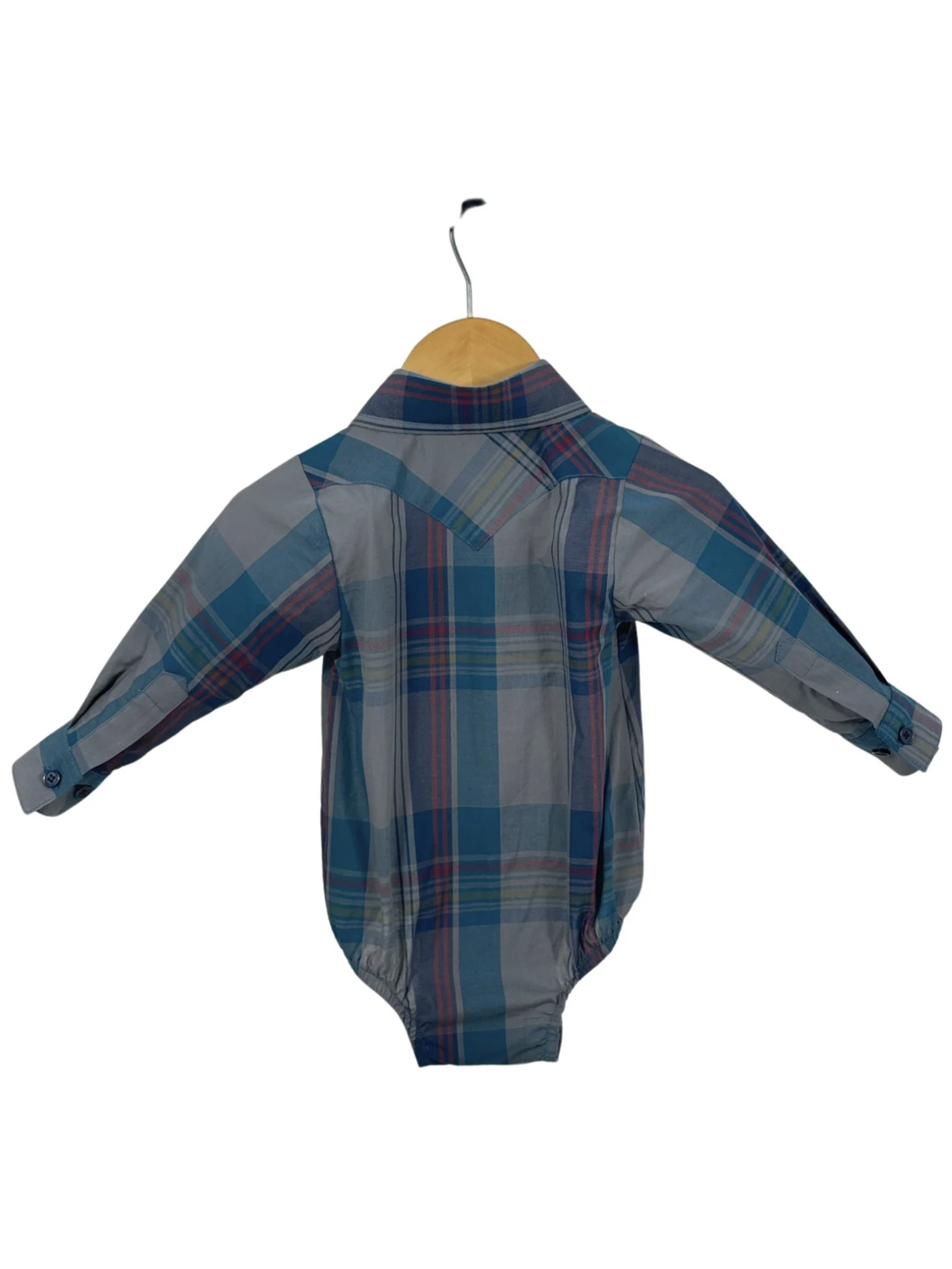 Plaid baby romper on a hanger against a white background