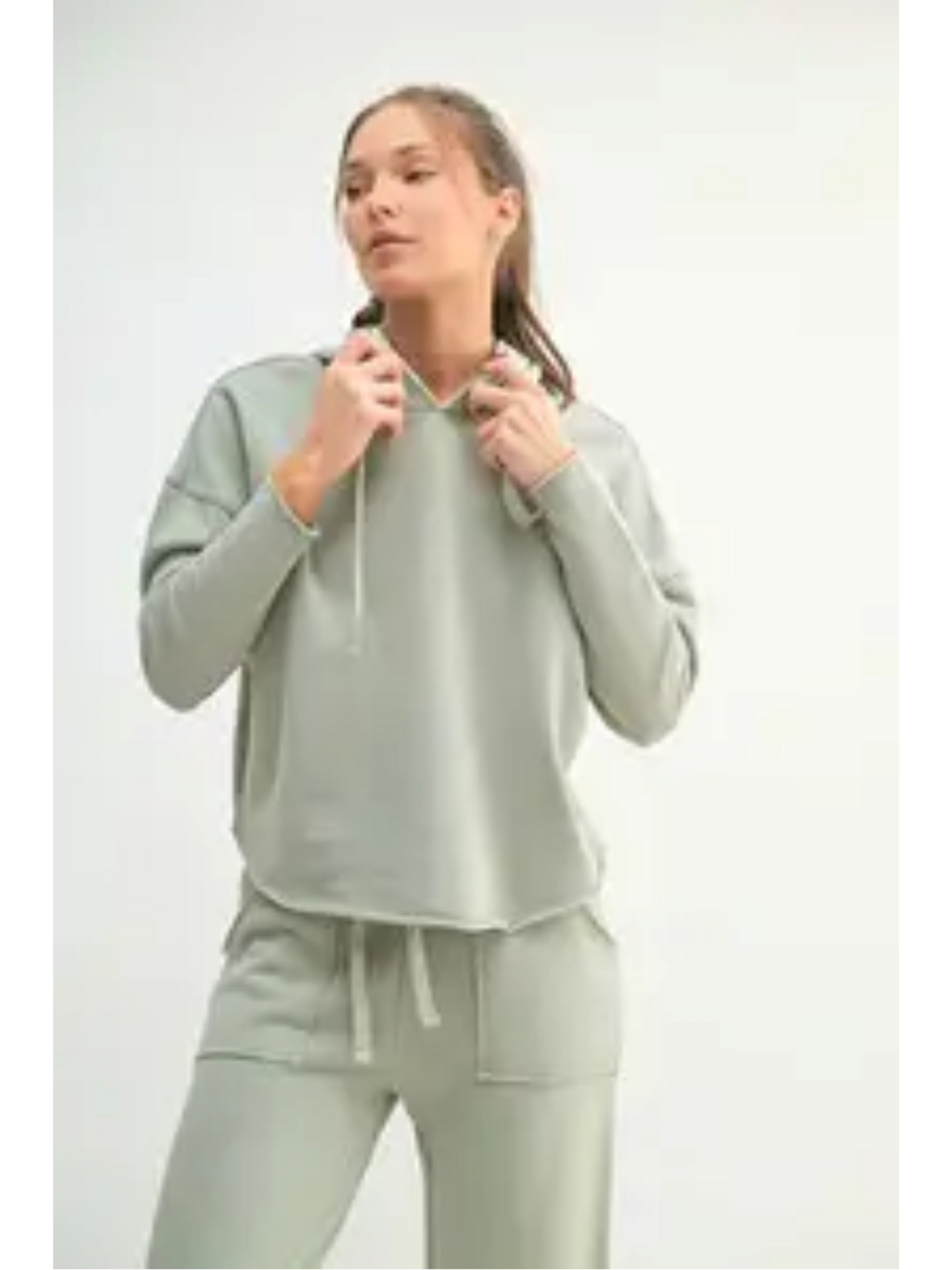 Relaxed-fit hoodie in a faded "Shadow" dark grey color, featuring a minimalist coastal design for an effortless, slow-living aesthetic.