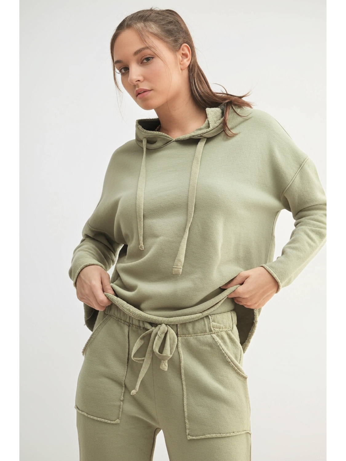 Relaxed-fit hoodie in a faded "Shadow" dark grey color, featuring a minimalist coastal design for an effortless, slow-living aesthetic.