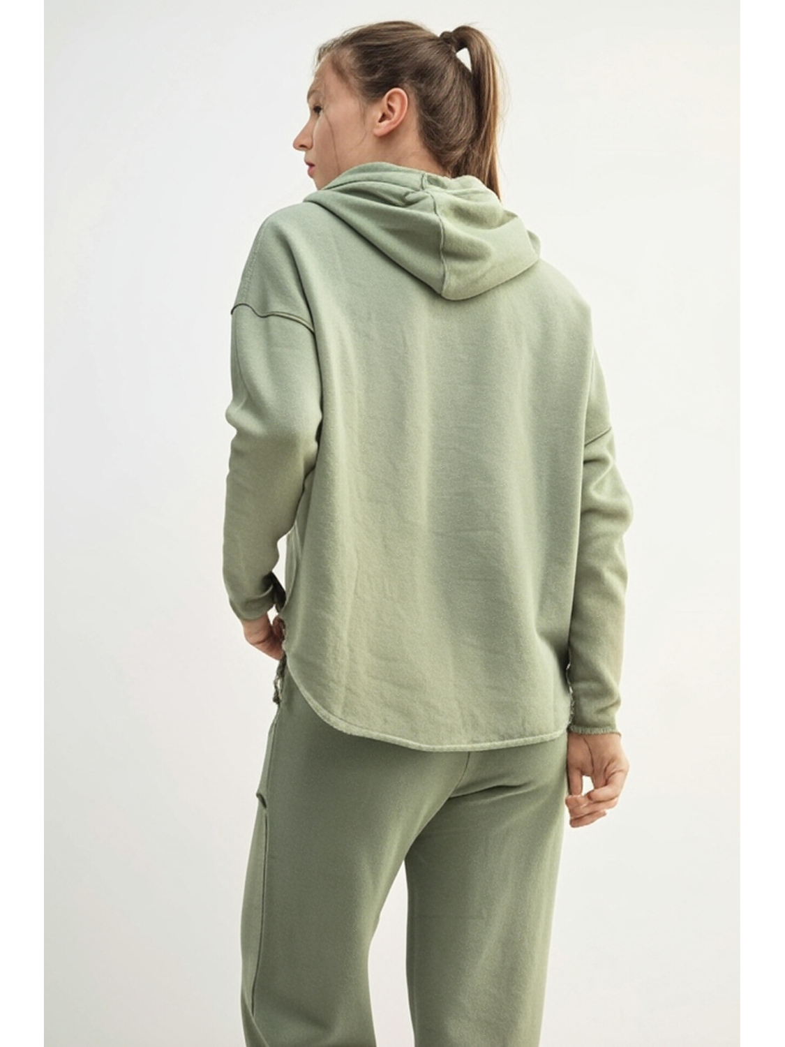 Relaxed-fit hoodie in a faded "Shadow" dark grey color, featuring a minimalist coastal design for an effortless, slow-living aesthetic.