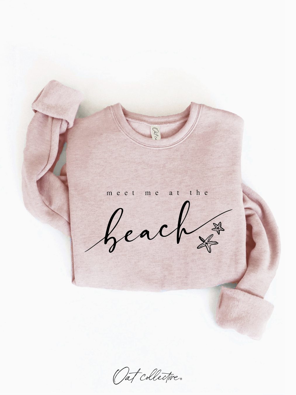 Cozy sweatshirt with a whimsical "Meet Me At the Beach" graphic, featuring a soft-brushed texture and a relaxed, soulful coastal aesthetic.