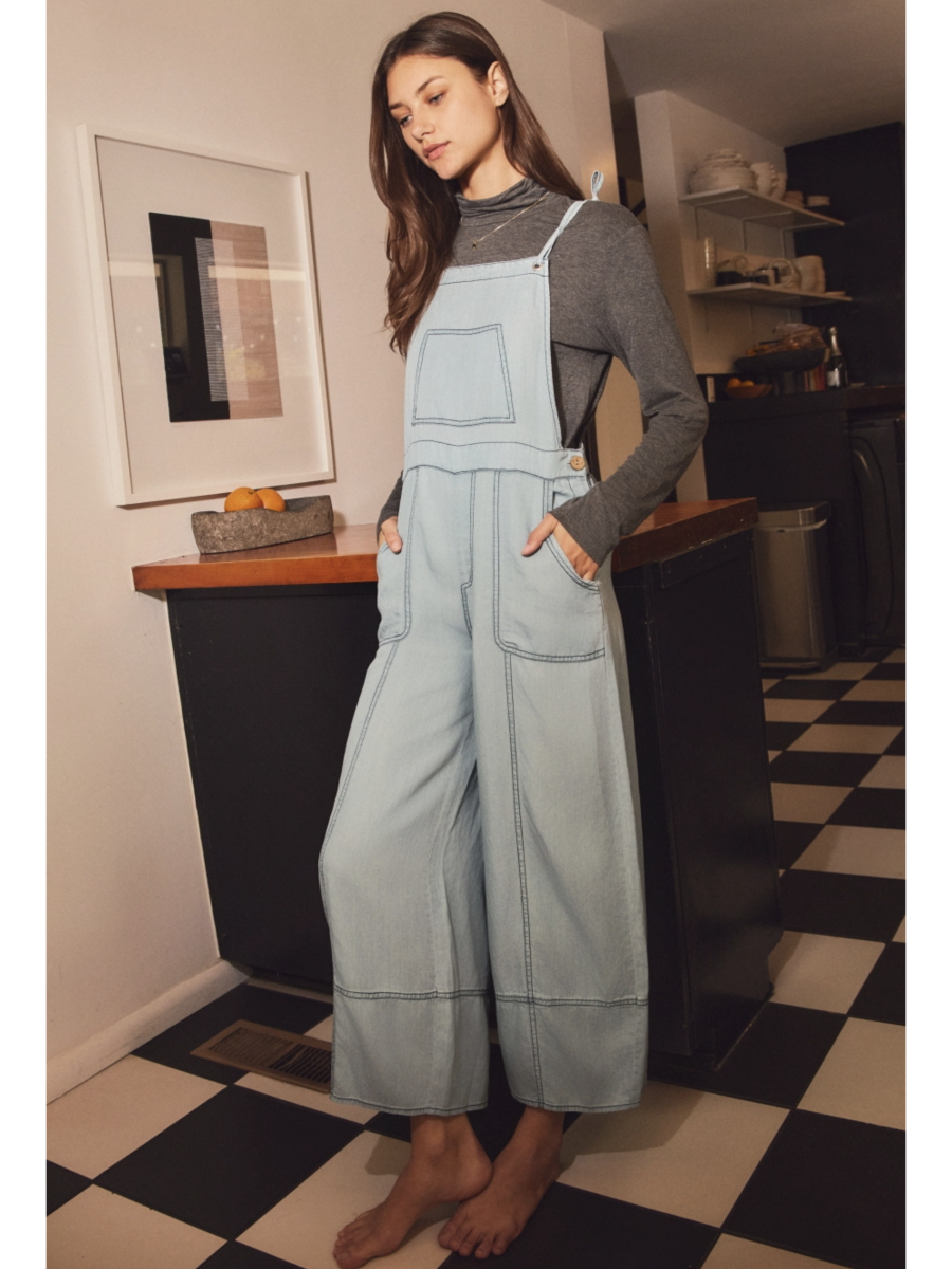 Plus size relaxed-fit chambray overall jumpsuit in a soft-wash blue denim with a whimsical, coastal, and slow-living aesthetic.