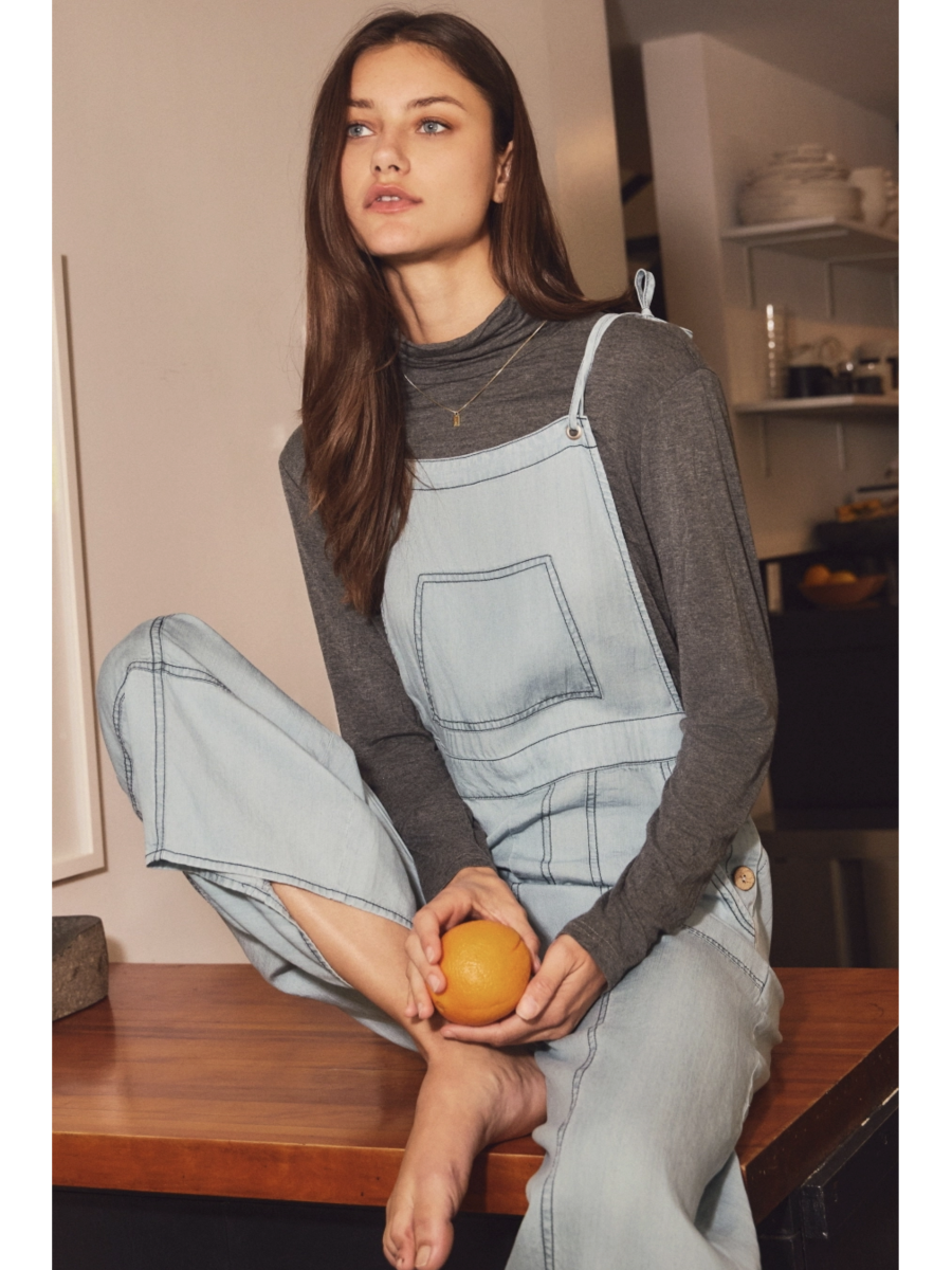 Plus size relaxed-fit chambray overall jumpsuit in a soft-wash blue denim with a whimsical, coastal, and slow-living aesthetic.