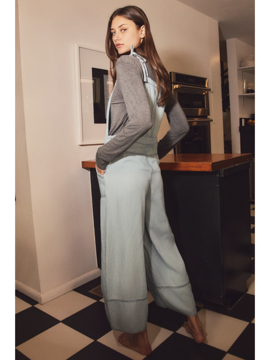 Plus size relaxed-fit chambray overall jumpsuit in a soft-wash blue denim with a whimsical, coastal, and slow-living aesthetic.