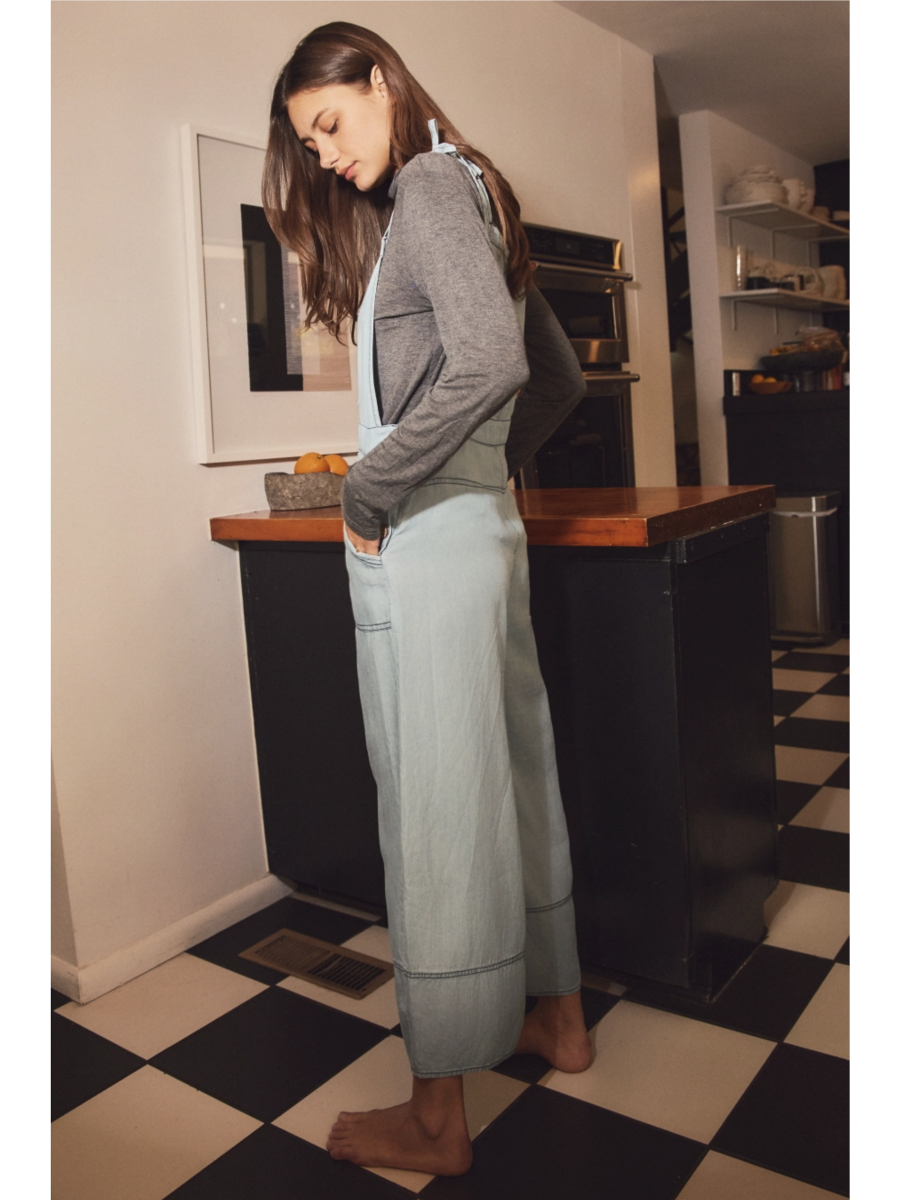 Plus size relaxed-fit chambray overall jumpsuit in a soft-wash blue denim with a whimsical, coastal, and slow-living aesthetic.