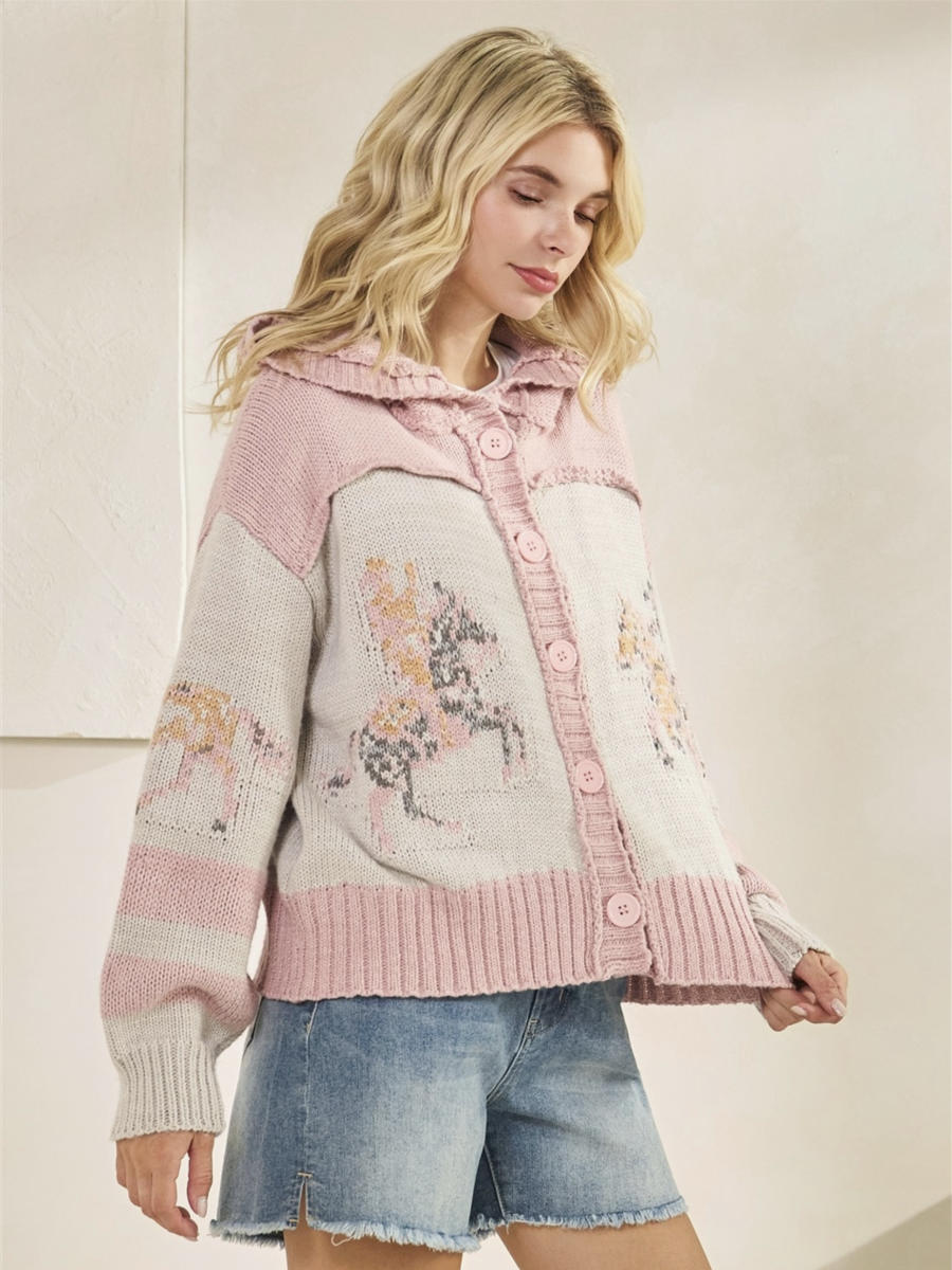 Woman wearing a pink and gray patterned jacket with denim shorts on a light background